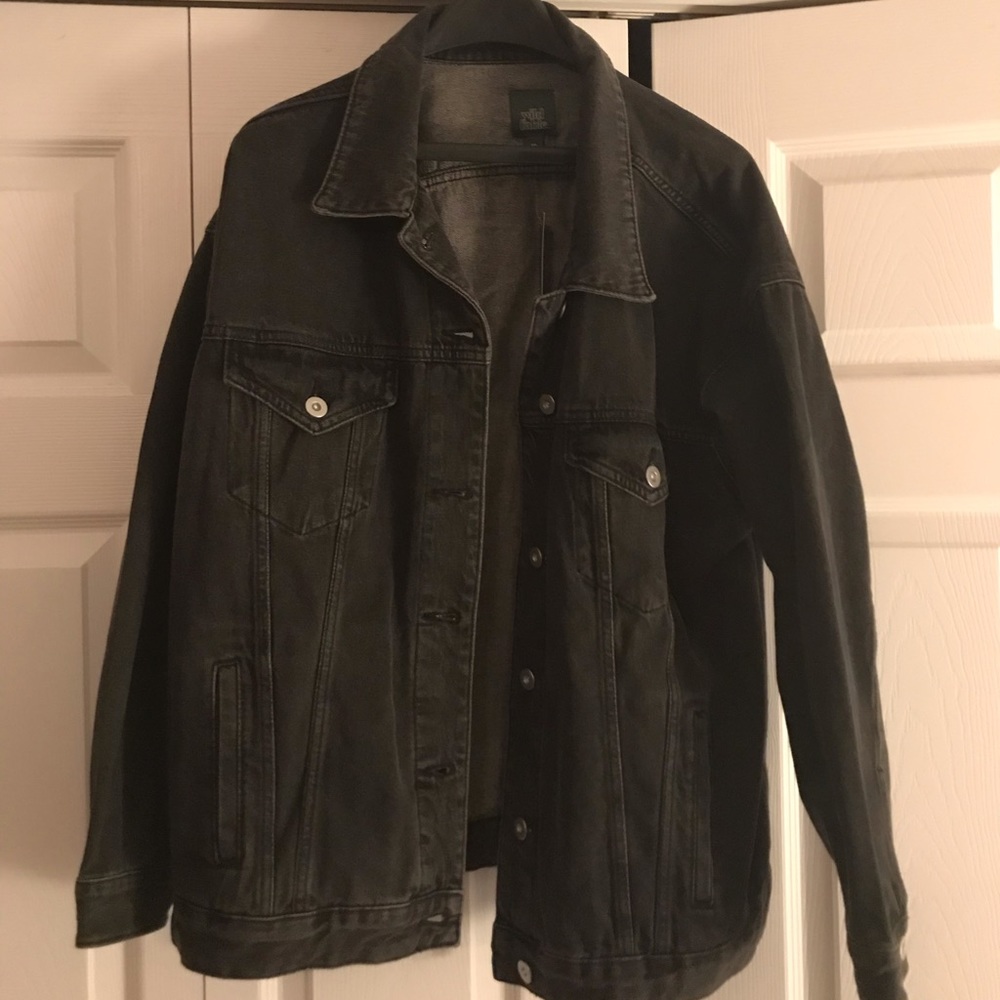 Women’s denim jacket in faded black.